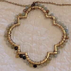 Necklace with stone bangles.